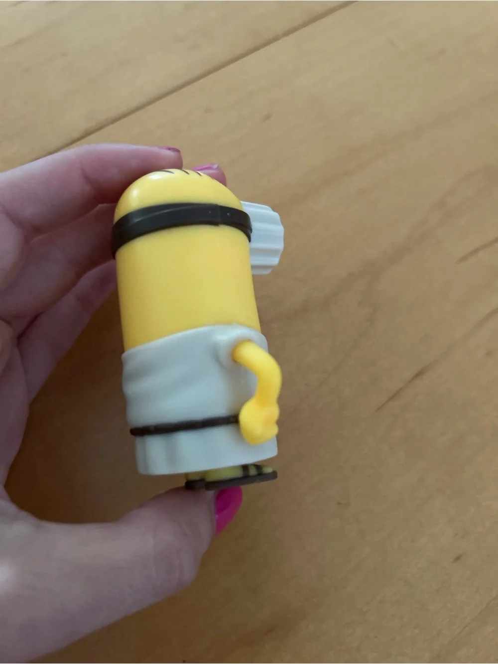 One-Eyed Yellow Action Figure with Brown Staff - Classic Cartoon Style
